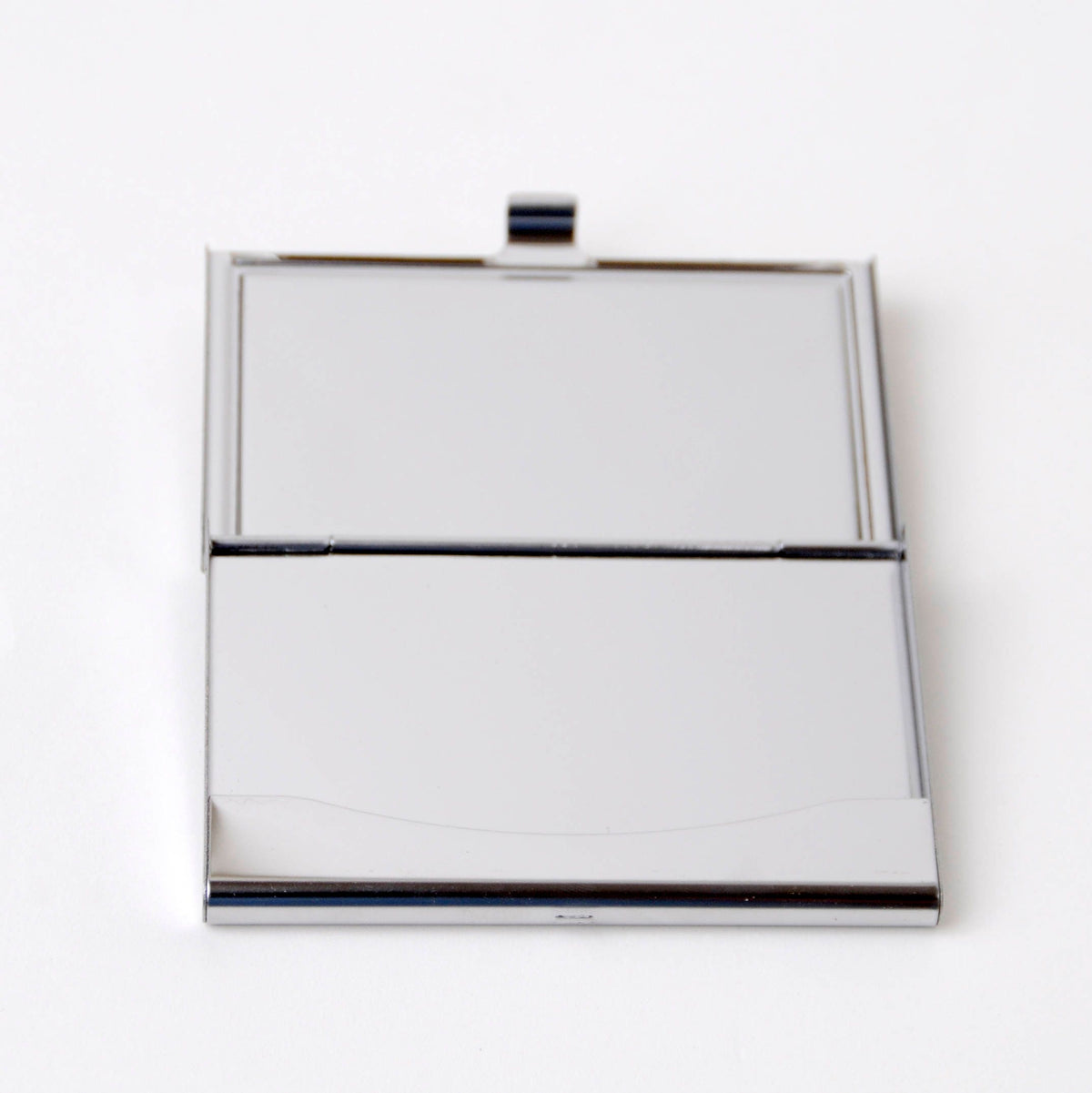 Closed silver card case with hinged top clasp