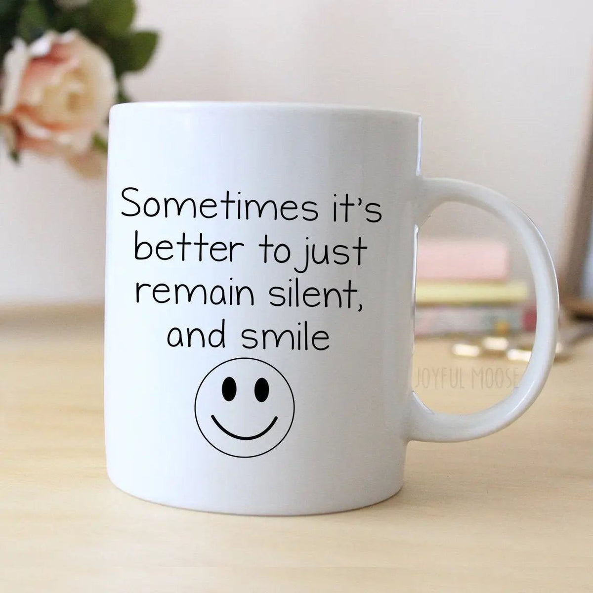 White coffee mug with handle, printed quote 'Sometimes it's better to just remain silent, and smile'