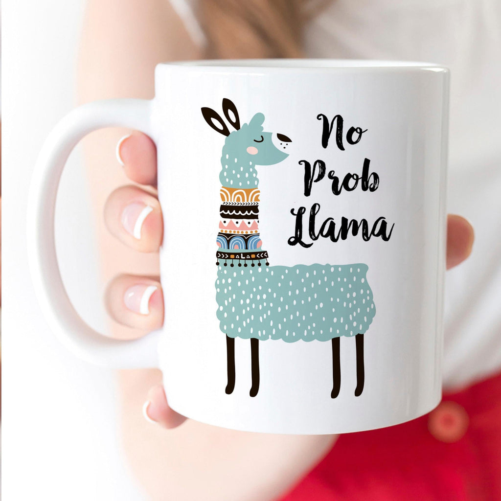 White ceramic coffee mug with cute teal llama and “No Prob Llama” text