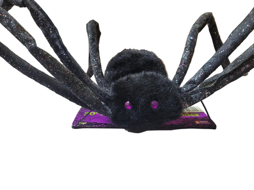 Black glitter posable spider prop with wide legs and purple eyes