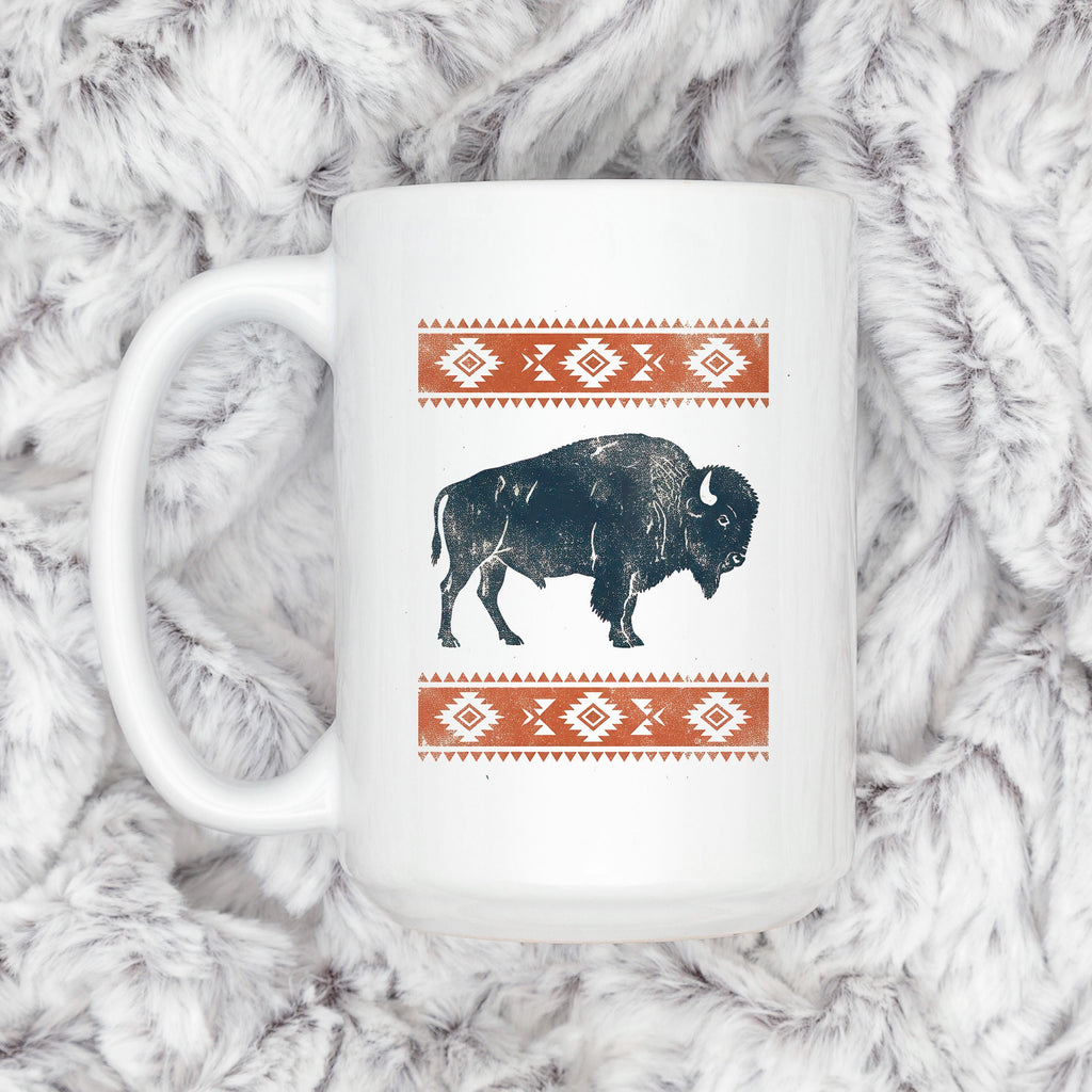 White mug with black bison graphic and orange geometric southwest trim
