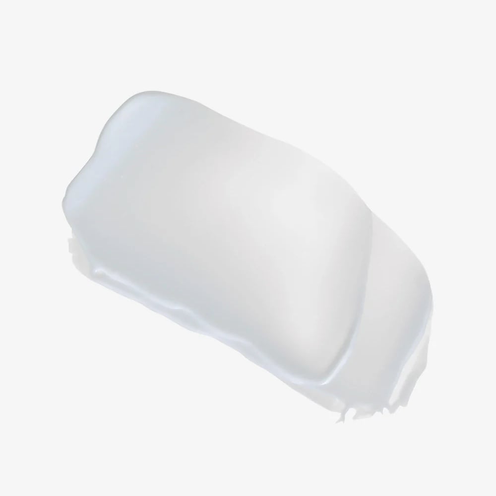 White eye cream on a translucent applicator tip