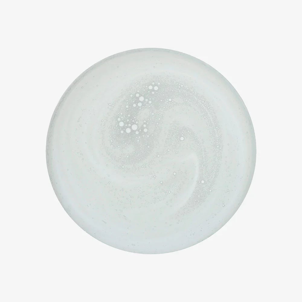 Vitamin C brightening booster serum swatch, translucent pale white gel