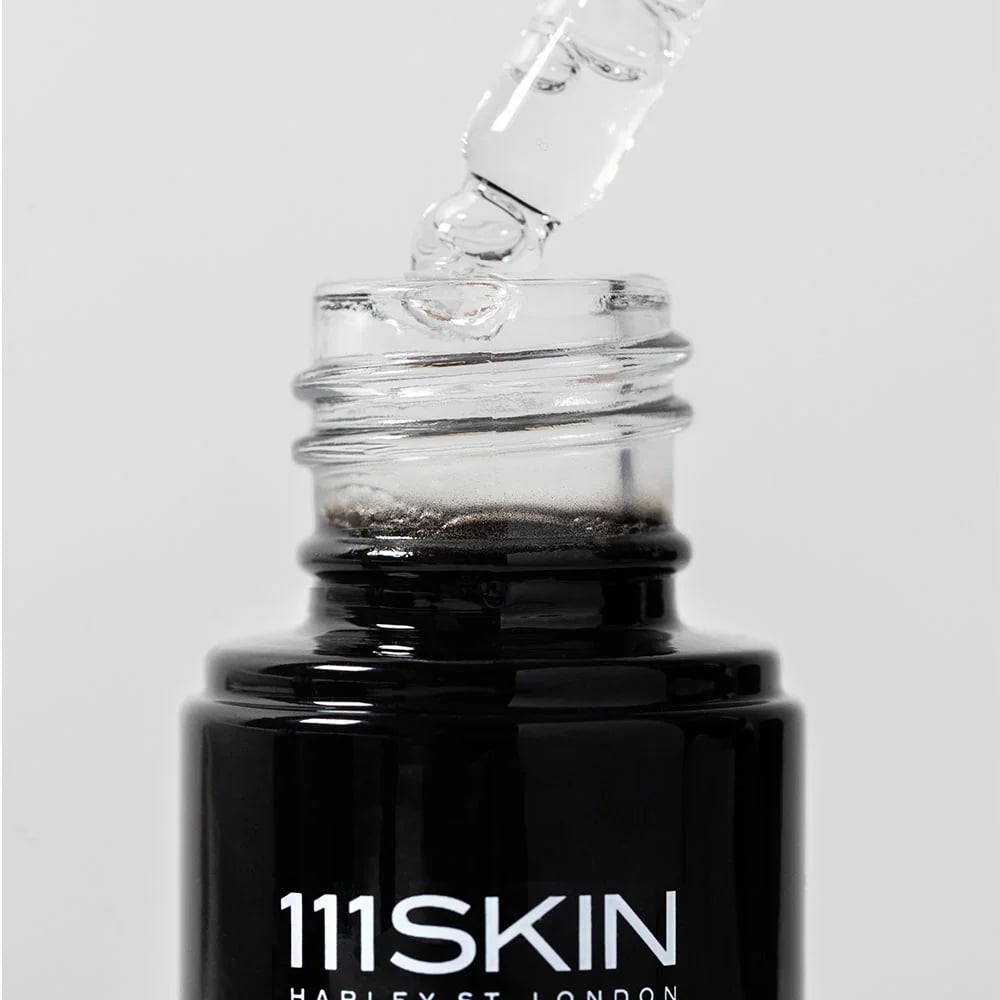 Vitamin C brightening booster bottle with clear dropper tip, 111SKIN label