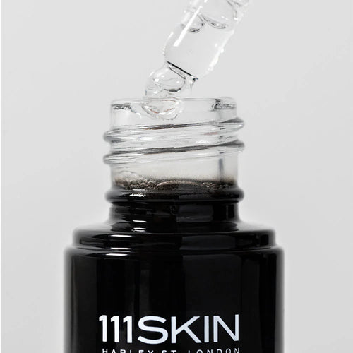 Vitamin C brightening booster bottle with clear dropper tip, 111SKIN label