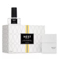 NEST wall diffuser set with grapefruit scent, clear bottle and patterned box packaging
