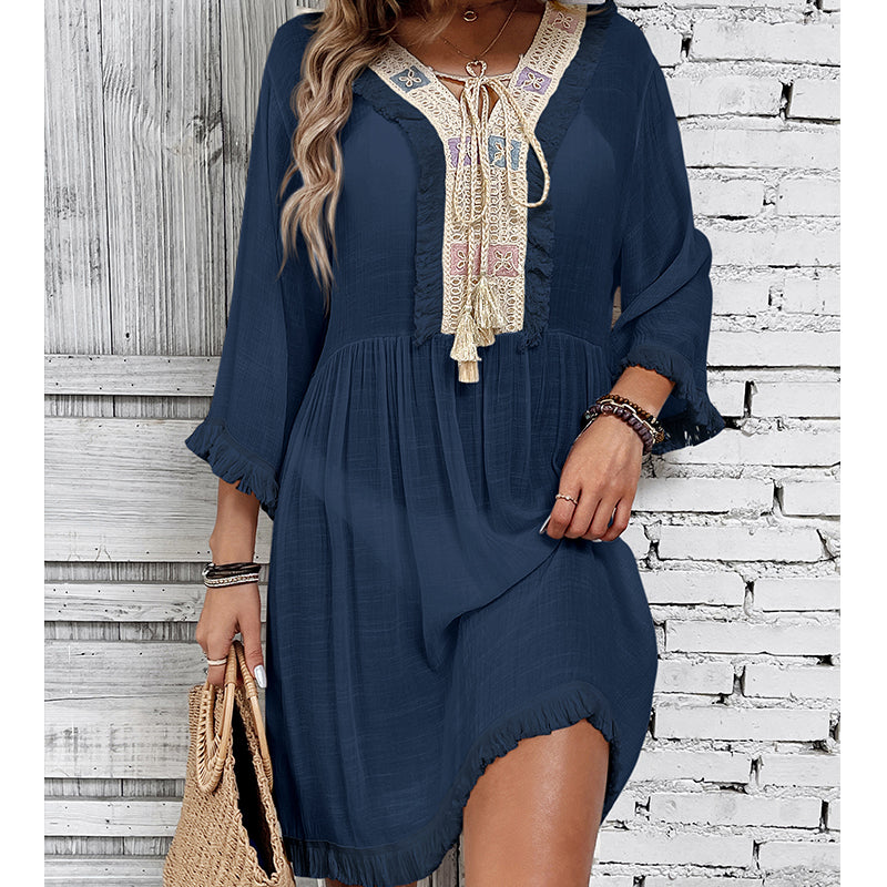 Navy lace-tassel tunic blouse with embroidered neckline and tiered ruffle hem