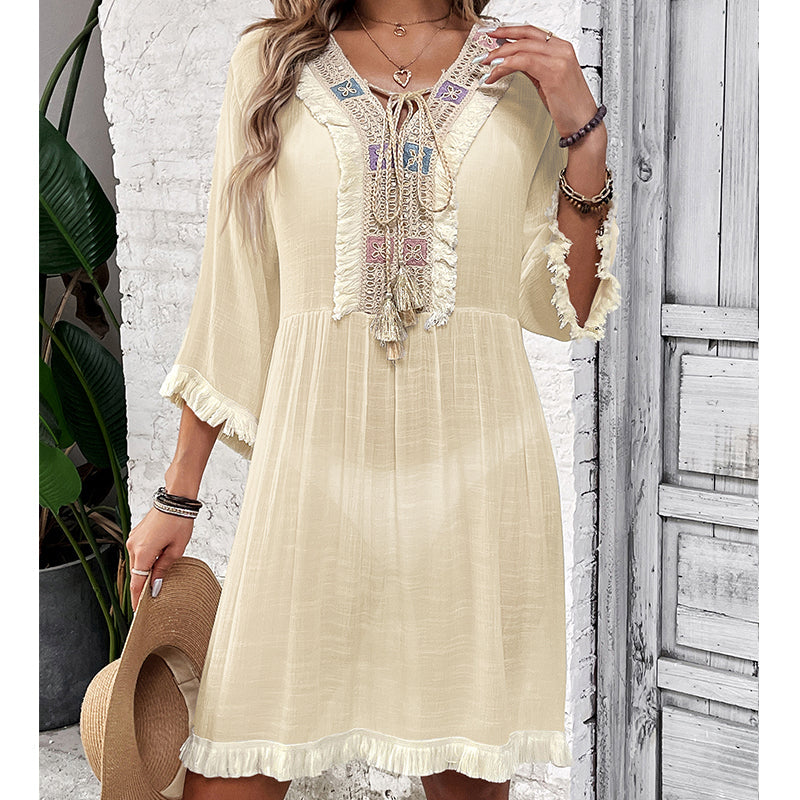 Cream lace-tassel tunic blouse with embroidered neckline and tiered ruffle hem
