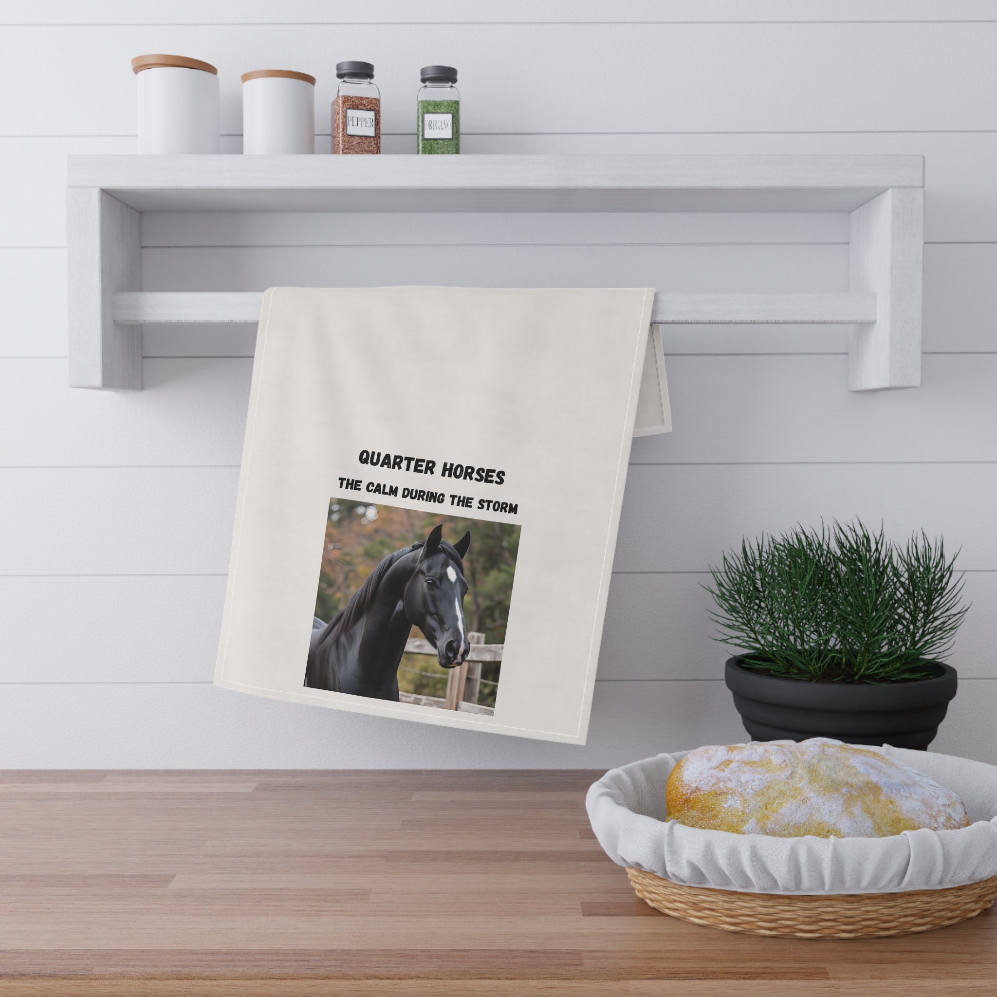 White kitchen towel with black horse photo and “The calm during the storm” text