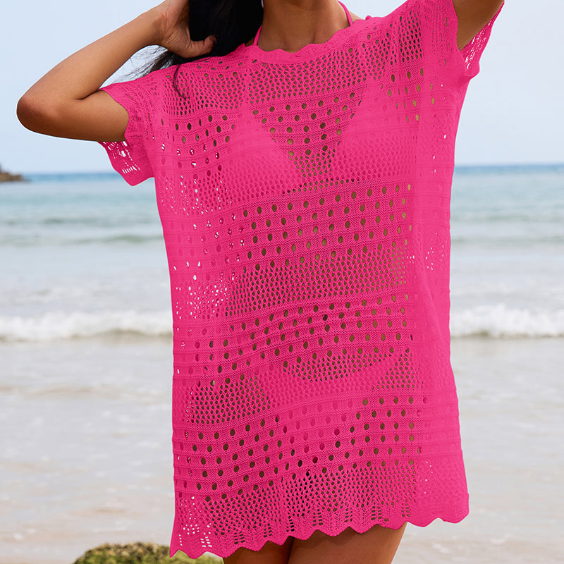 Bright pink crochet lace beach blouse front view, short sleeves, scalloped hem, openwork.