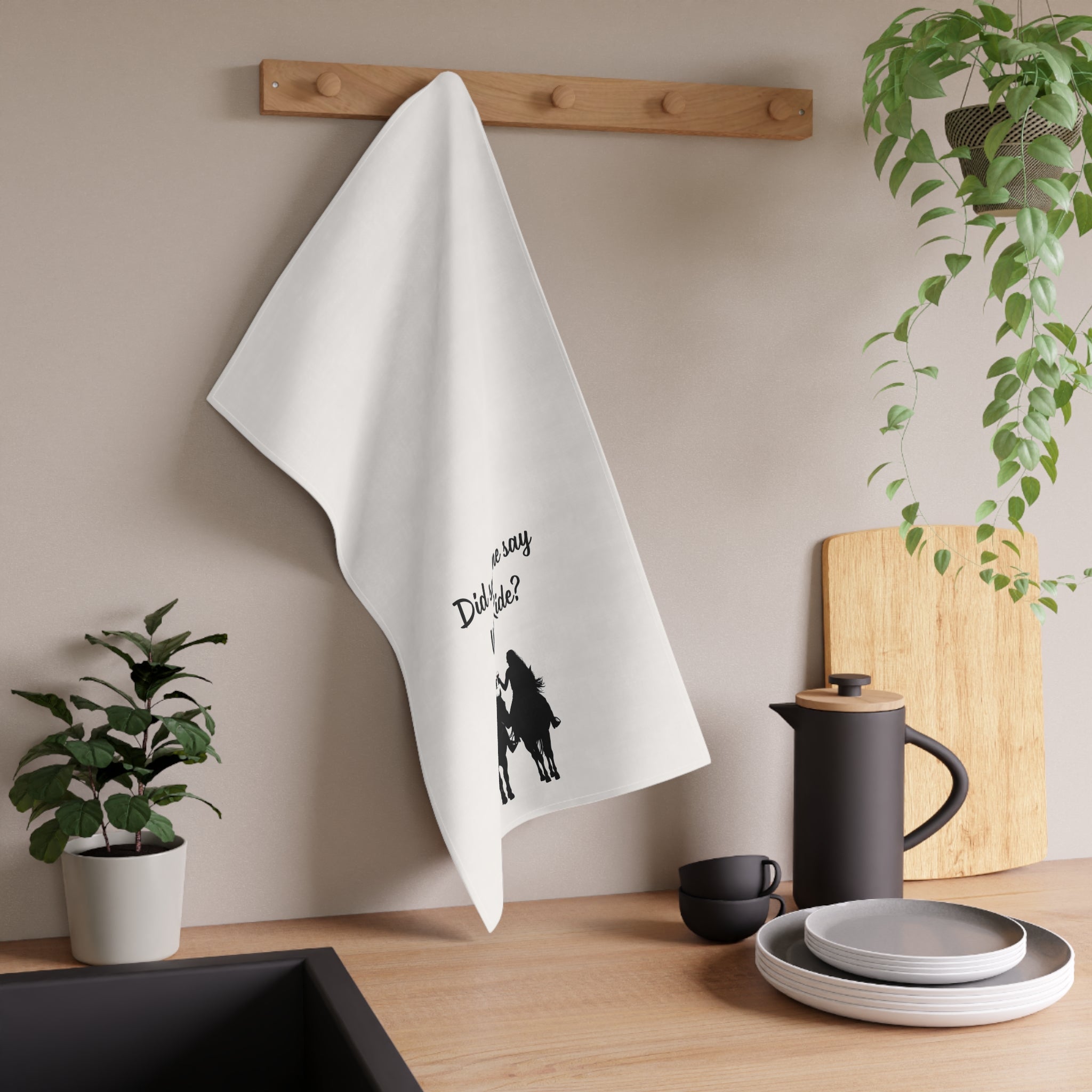 Hanging wine-themed cowgirl tea towel, “Did someone say Wine Ride?” quote and horses