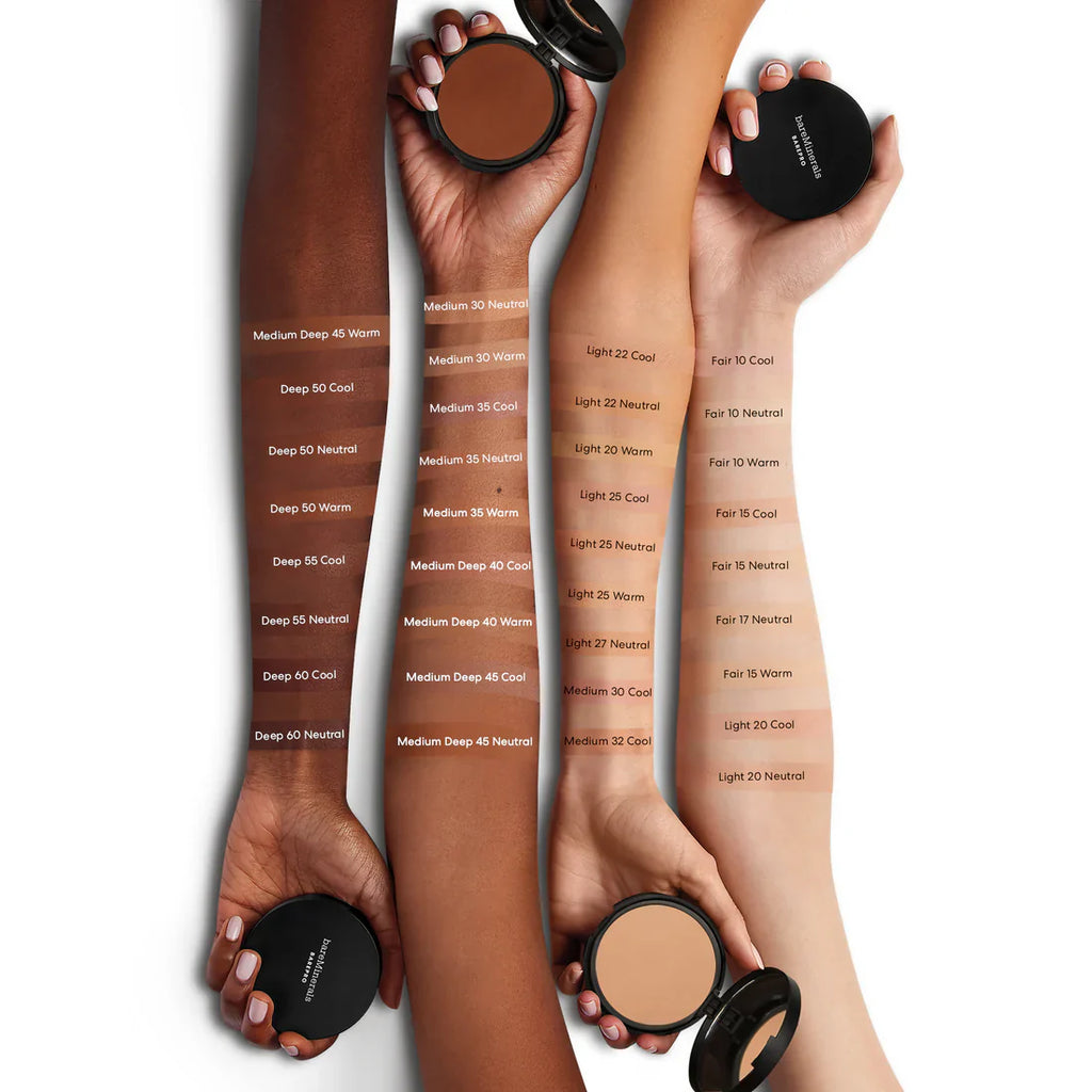Powder foundation shade assortment on hands, multiple beige compacts with labels
