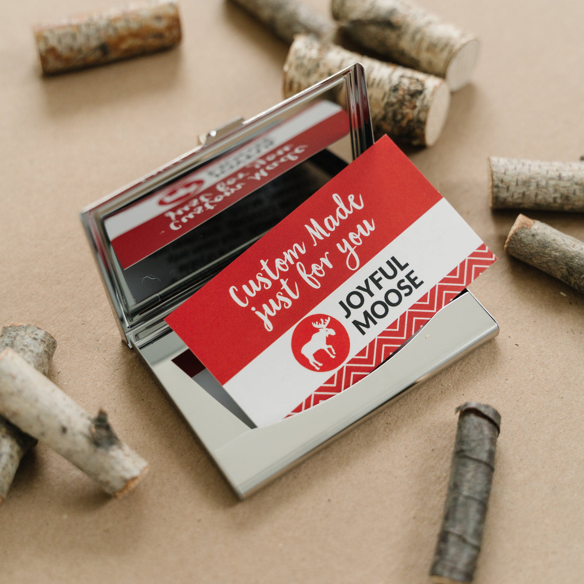 Engraved card holder holding a red-and-white gift card insert with “Custom Made” text