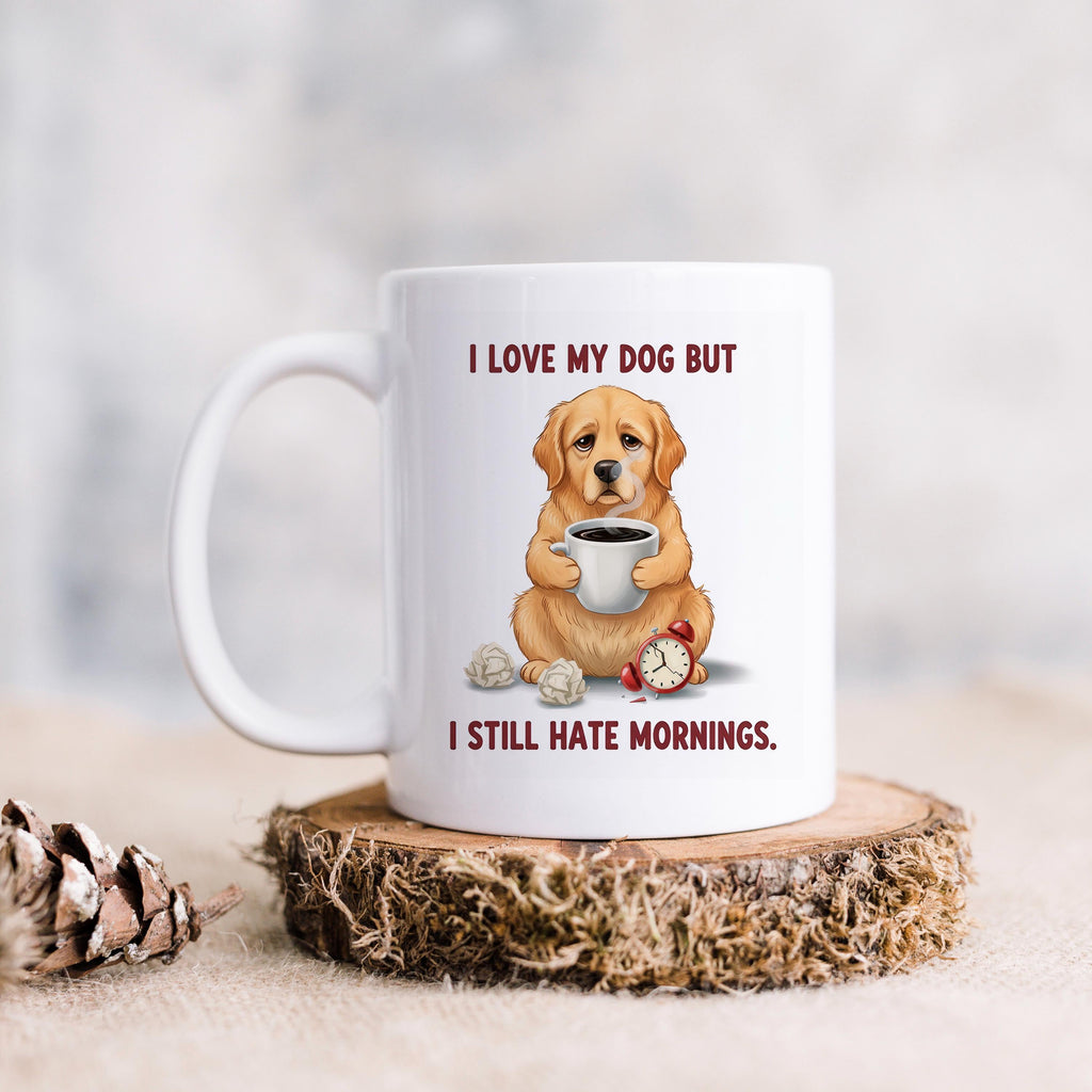 White ceramic dog lover mug with dog holding coffee; red alarm clock and text: I love my dog but I still hate mornings.