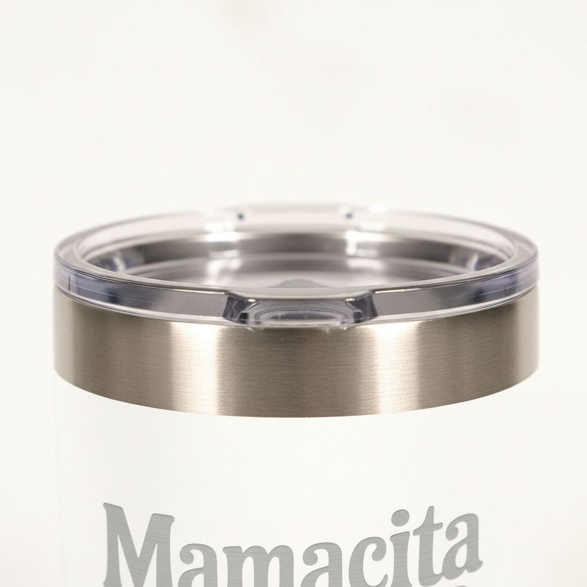 Stainless lid close-up on white insulated tumbler with Mamacita needs a Margarita text