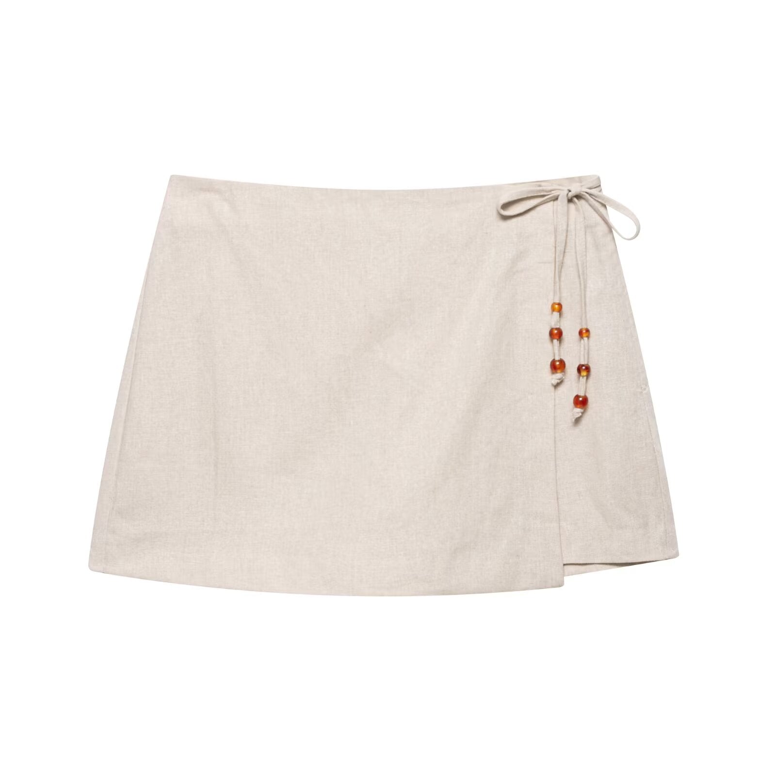 Light beige mini skirt with drawstring waist and dangling bead tassel detail
