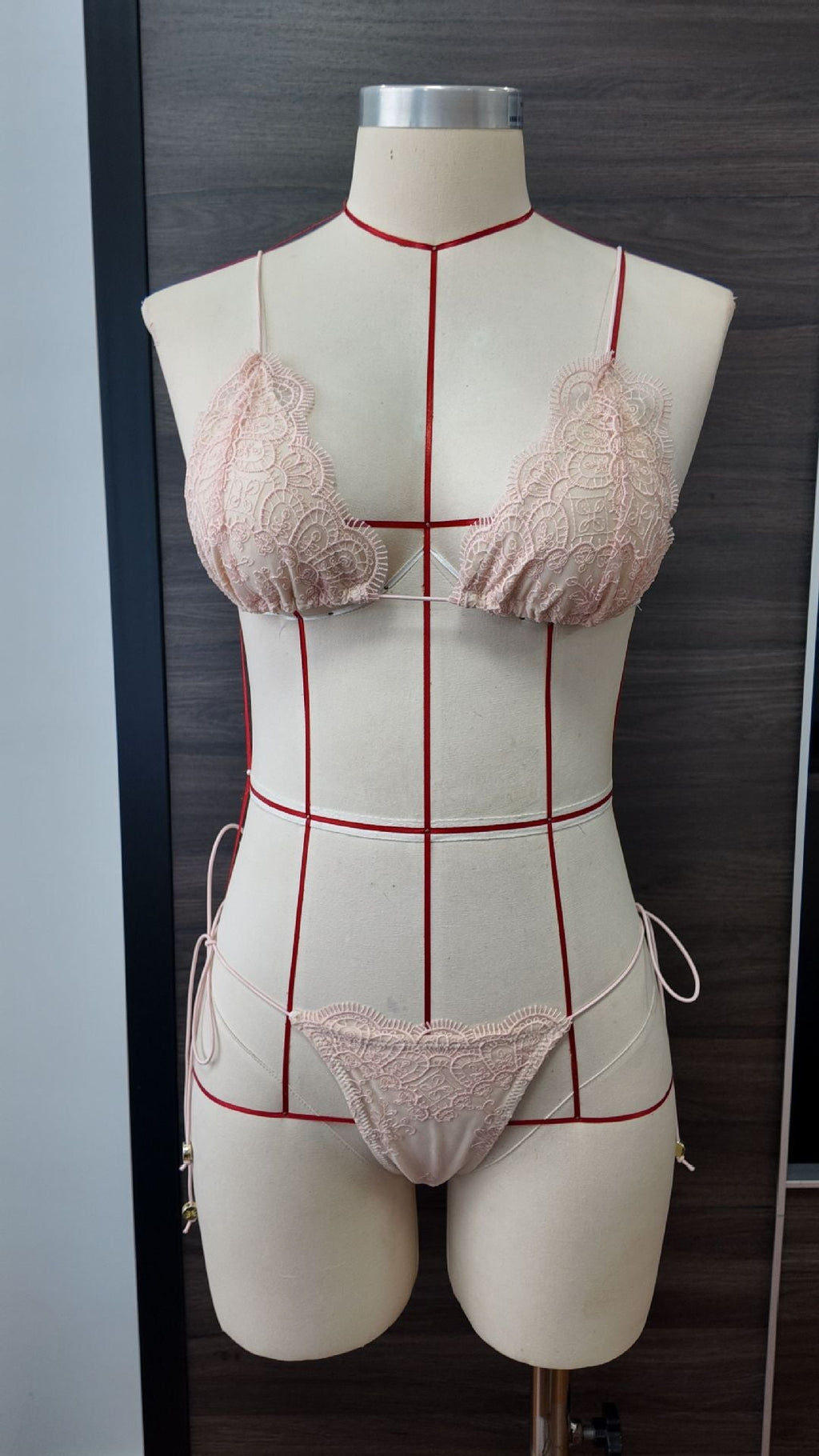 Two-tone lace bikini swimsuit with pink lace triangle cups, red trim, and tie-side bottoms