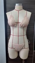 Two-tone lace bikini swimsuit with pink lace triangle cups, red trim, and tie-side bottoms