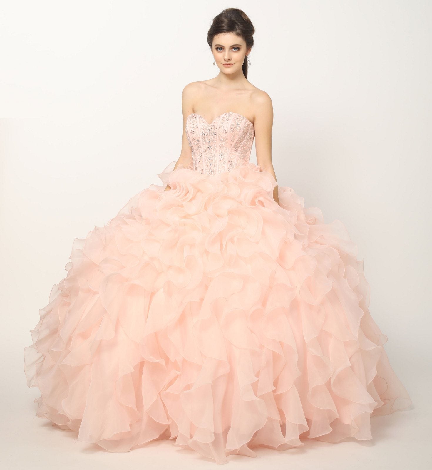 Light pink strapless ball gown with beaded corset bodice and layered organza ruffle skirt, front