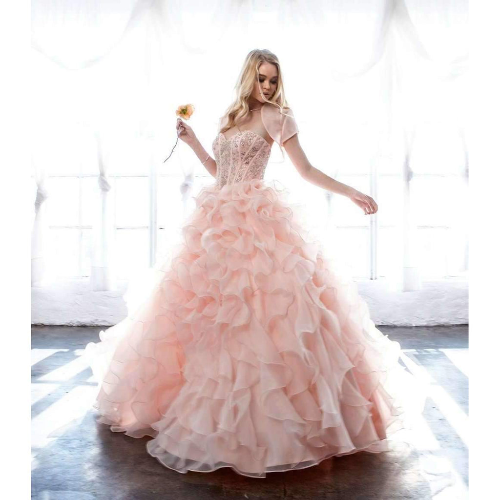 Light pink strapless ball gown with beaded corset bodice and layered organza ruffle skirt, full length