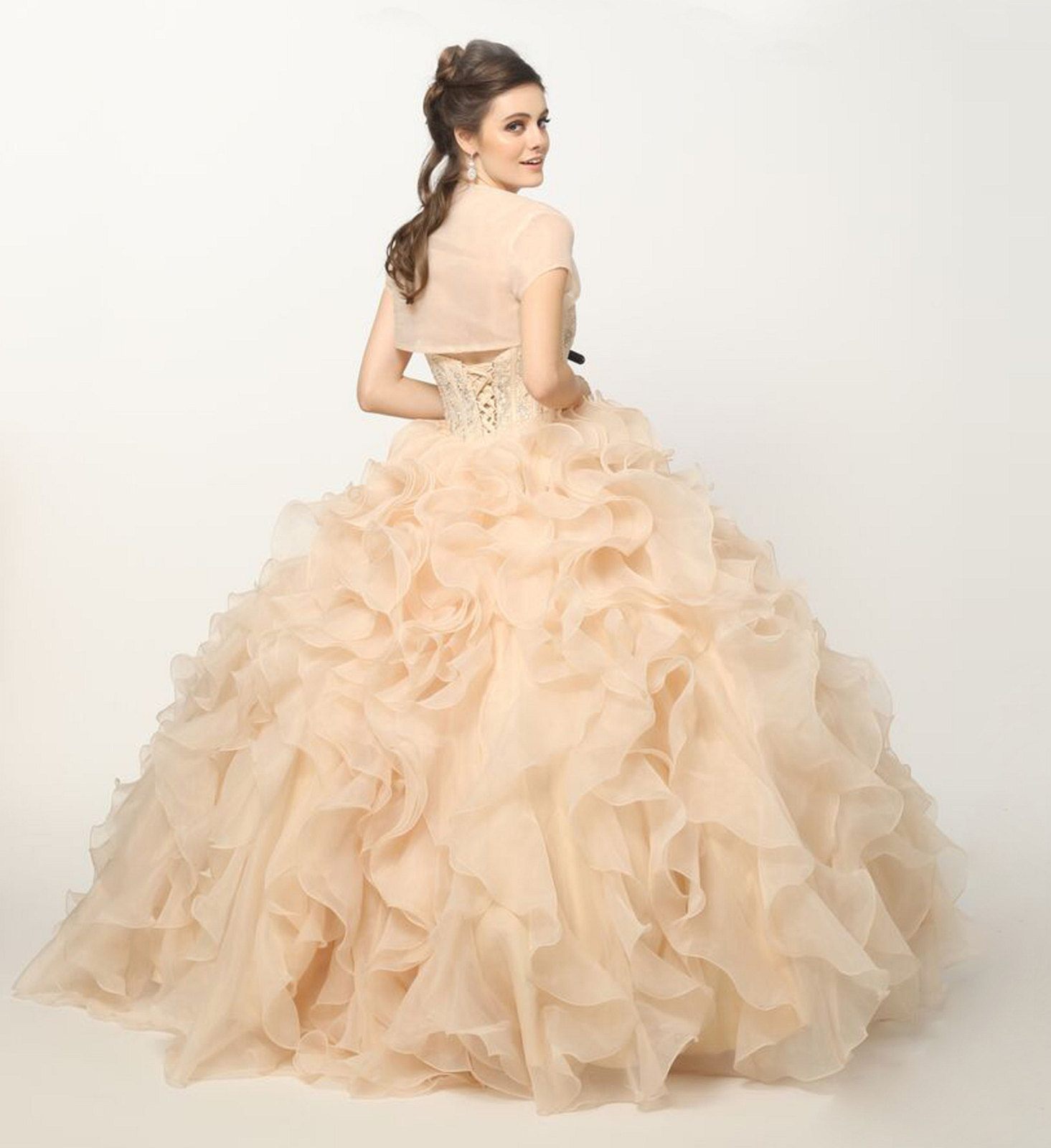 Champagne strapless ball gown with beaded corset bodice and layered organza ruffle skirt, back side