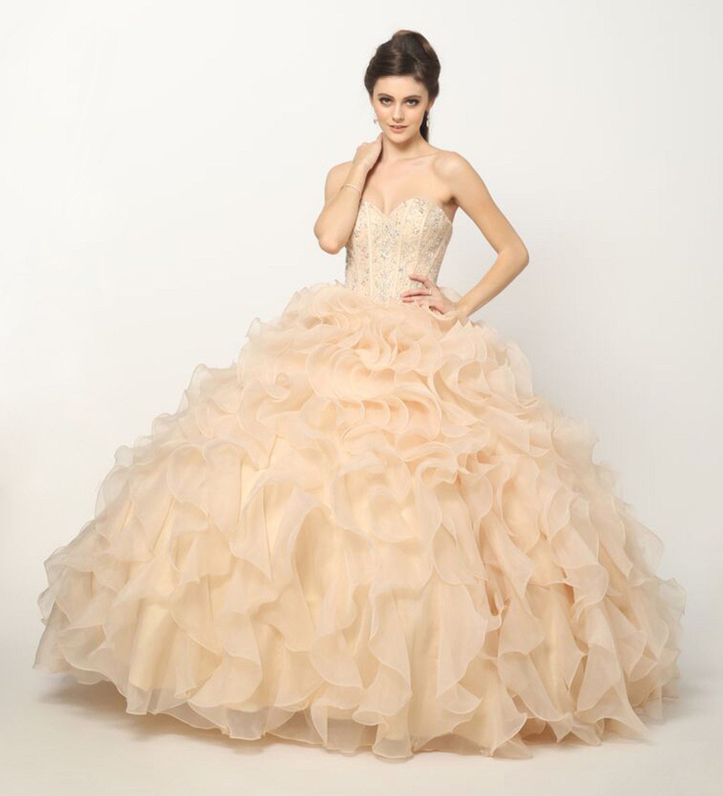 Champagne strapless ball gown with beaded corset bodice and layered organza ruffle skirt