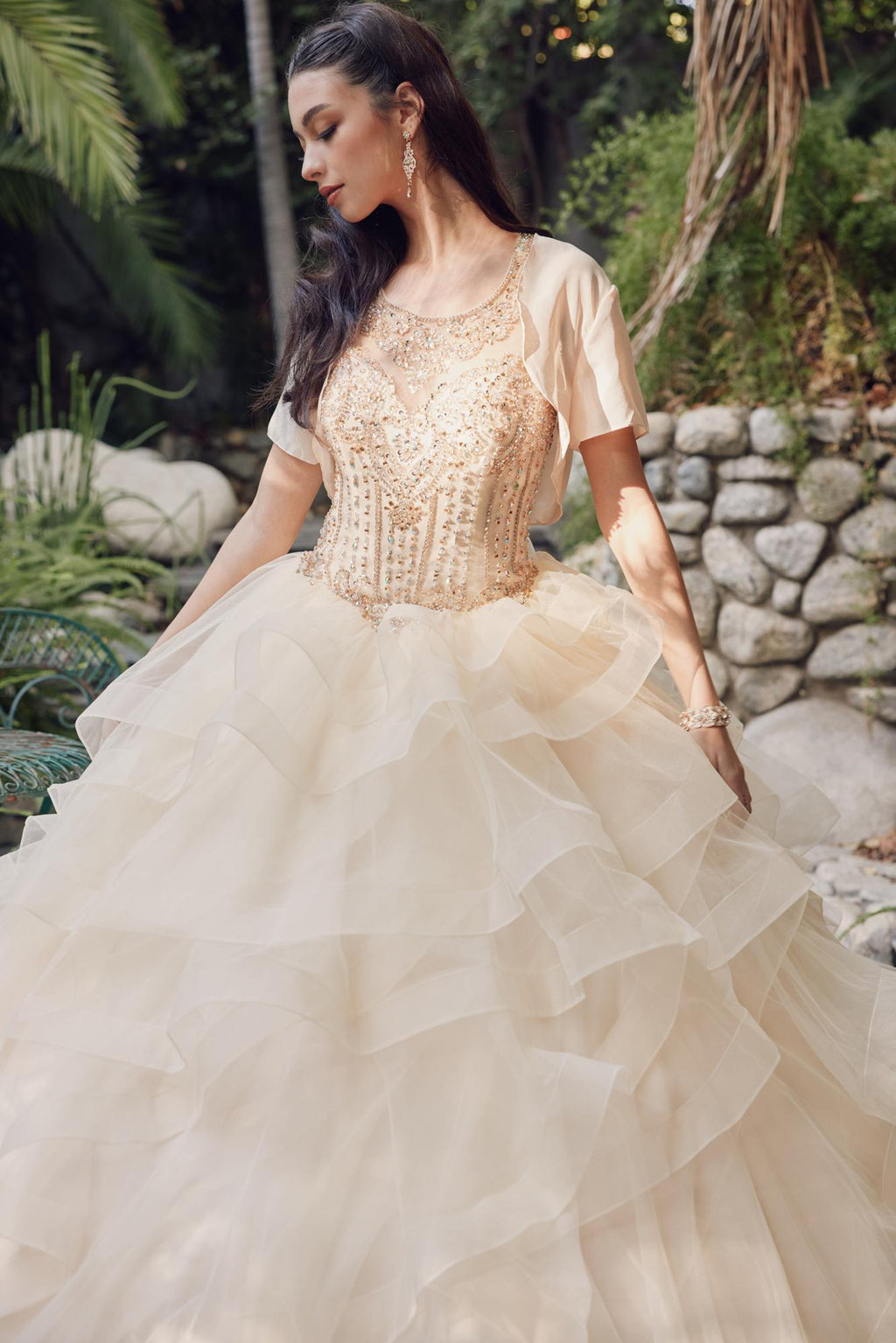 Champagne A-line ball gown with embellished bodice, sheer short sleeves, and ruffled tulle skirt