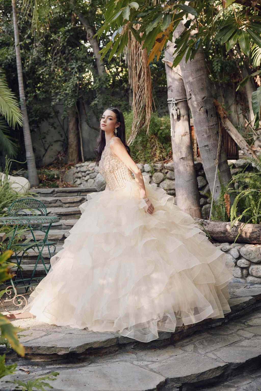 Champagne princess ball gown with tiered ruffled tulle skirt and embellished bodice