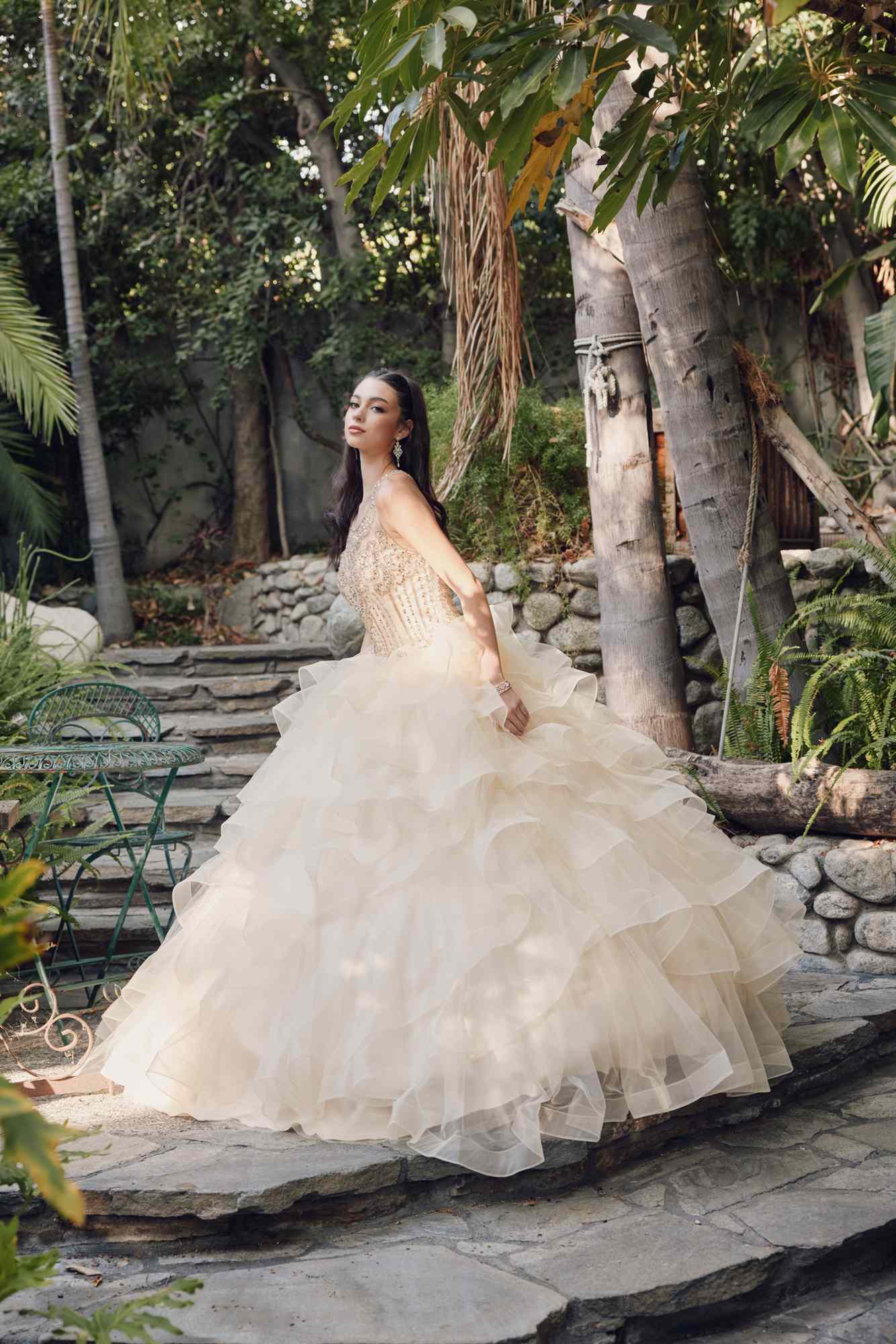 Champagne princess ball gown with tiered ruffled tulle skirt and embellished bodice
