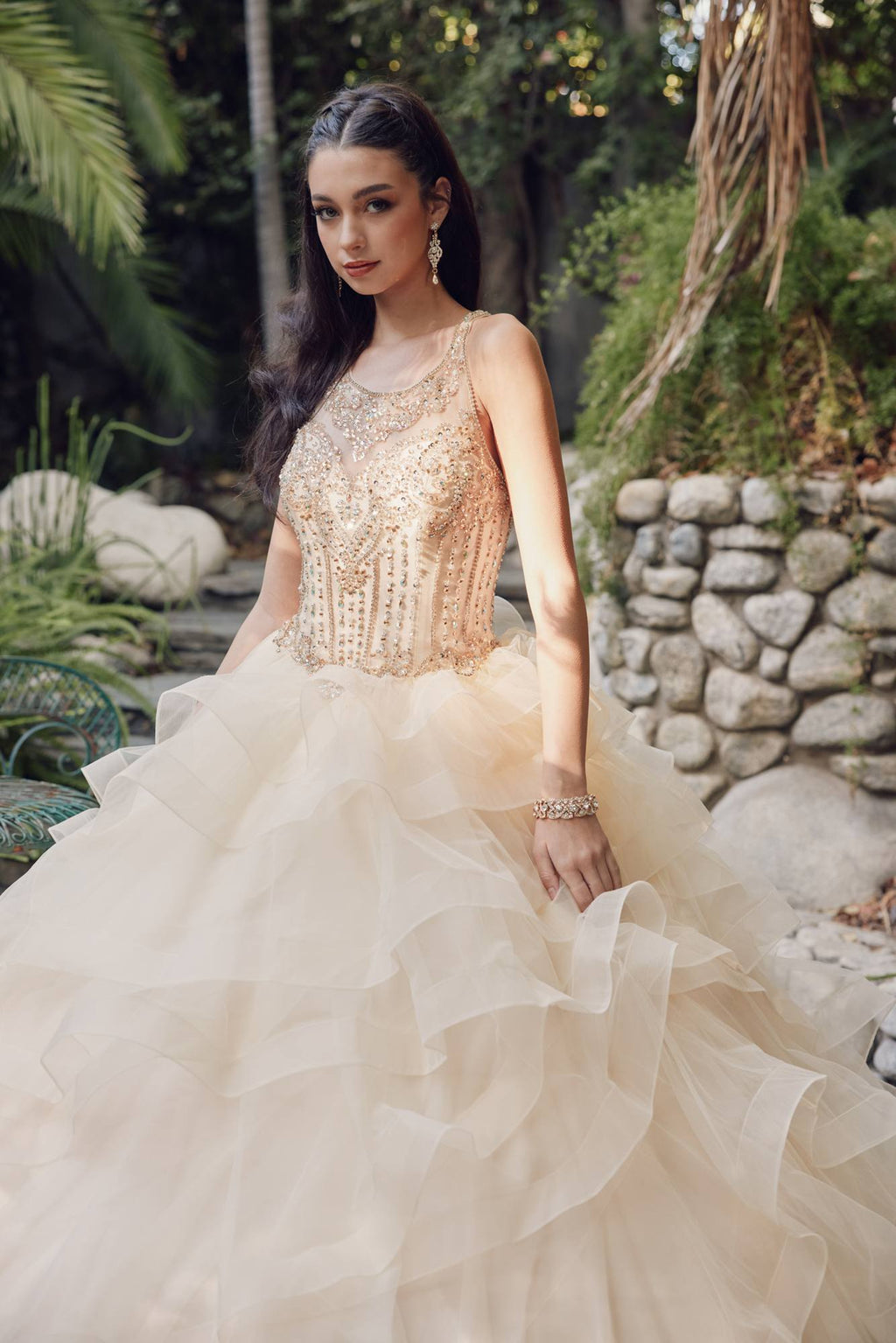 Champagne corset-style bodice with sheer short sleeves and tiered ruffled tulle skirt