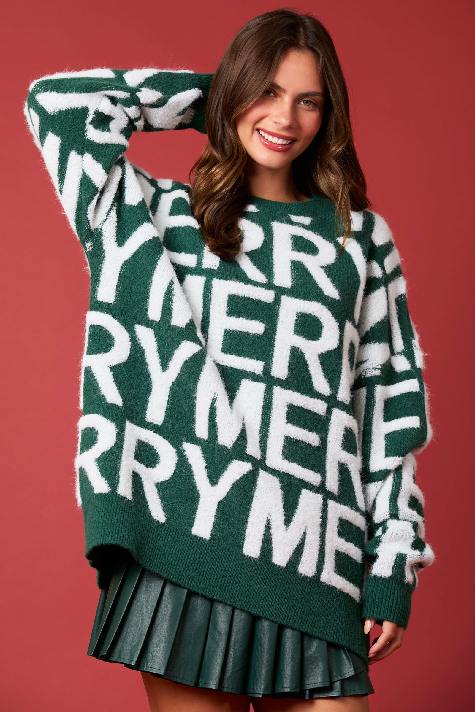 Green loose knit long-sleeve pullover sweater with large white letter graphic