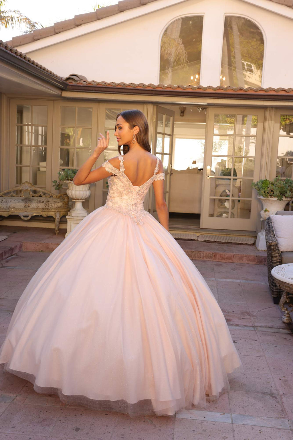 Light pink embroidered off-shoulder ball gown with sparkling bodice and tulle layers