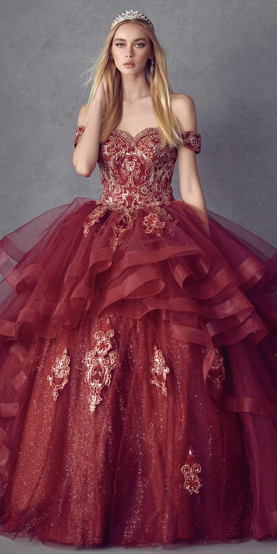 Burgundy off-shoulder ball gown with glitter fabric, embroidered accents, and tiered tulle skirt