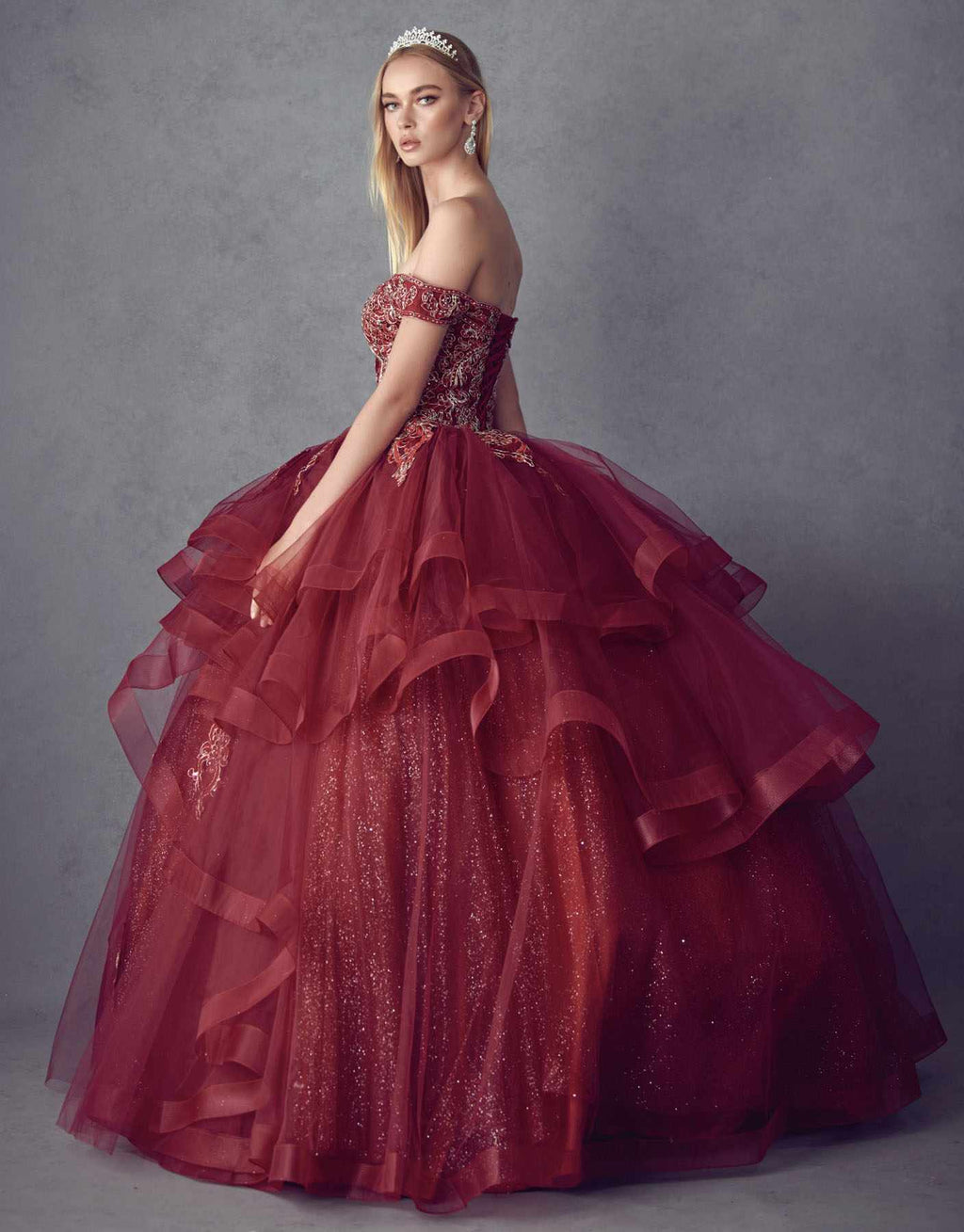 Burgundy off-shoulder ball gown with glitter bodice and layered tulle skirt with lace appliques
