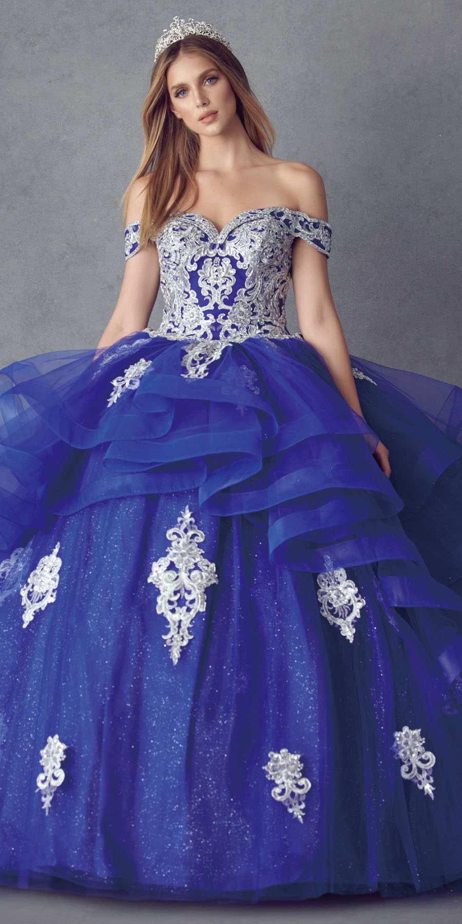 Deep blue ball gown with off-shoulder bodice and tiered tulle skirt with lace embroidery