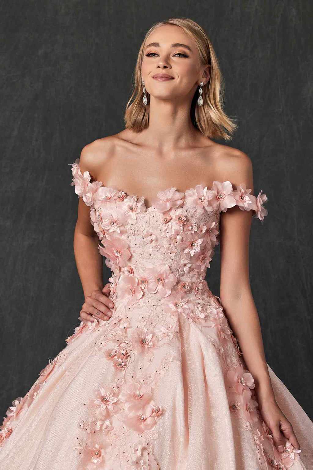Blush off-shoulder ball gown with 3D floral appliqués across bodice and soft skirt