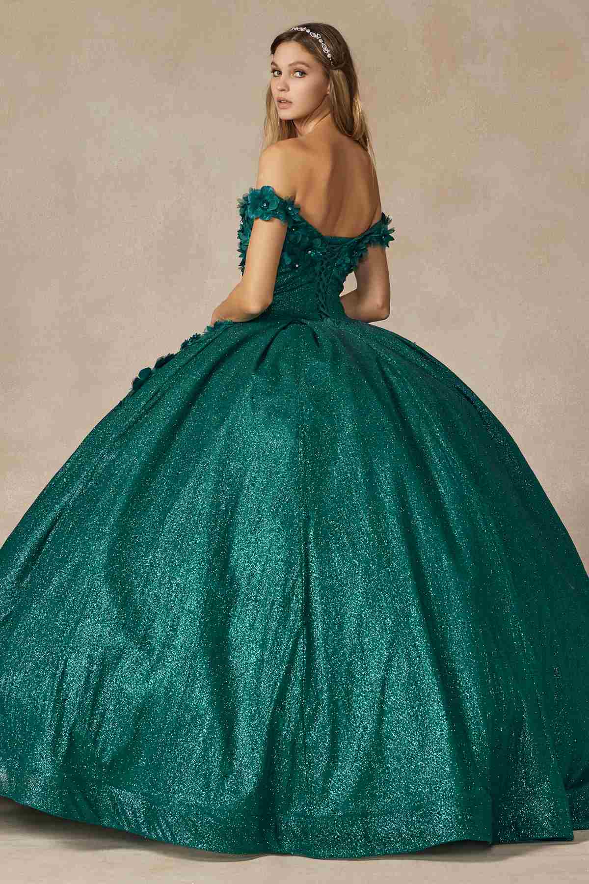 Green off-shoulder ball gown with glitter fabric, floral strap details, and full flared skirt