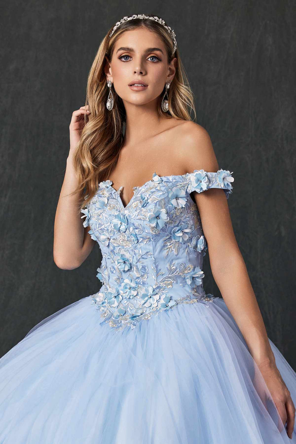Bahama blue quinceanera ball gown close-up, off-shoulder ruffled details and 3D floral embroidery