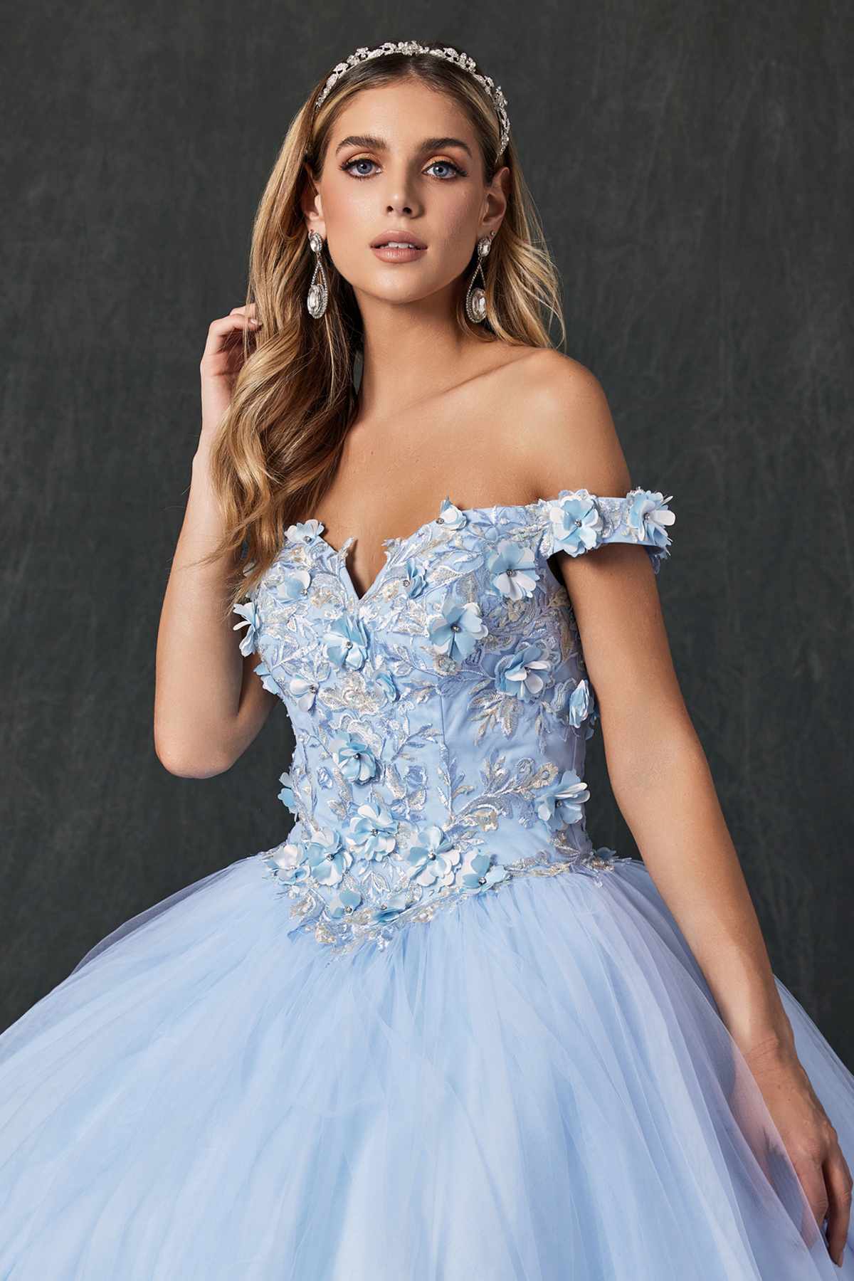 Bahama blue quinceanera ball gown close-up, off-shoulder ruffled details and 3D floral embroidery
