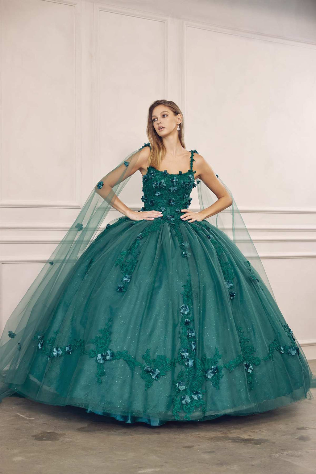 Emerald green A-line ball gown with beaded floral bodice and voluminous tulle skirt