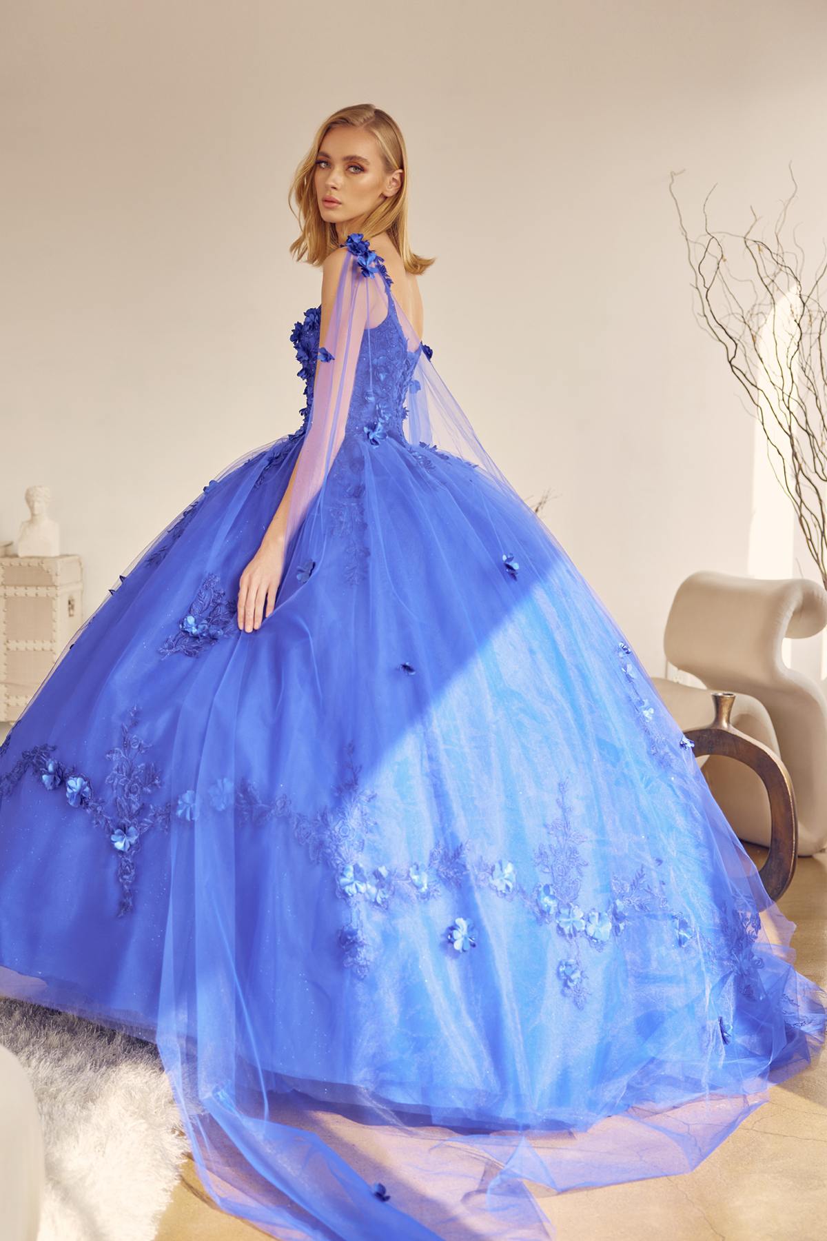 A-line ball quinceanera gown in royal blue with floral appliques and long sheer back drape
