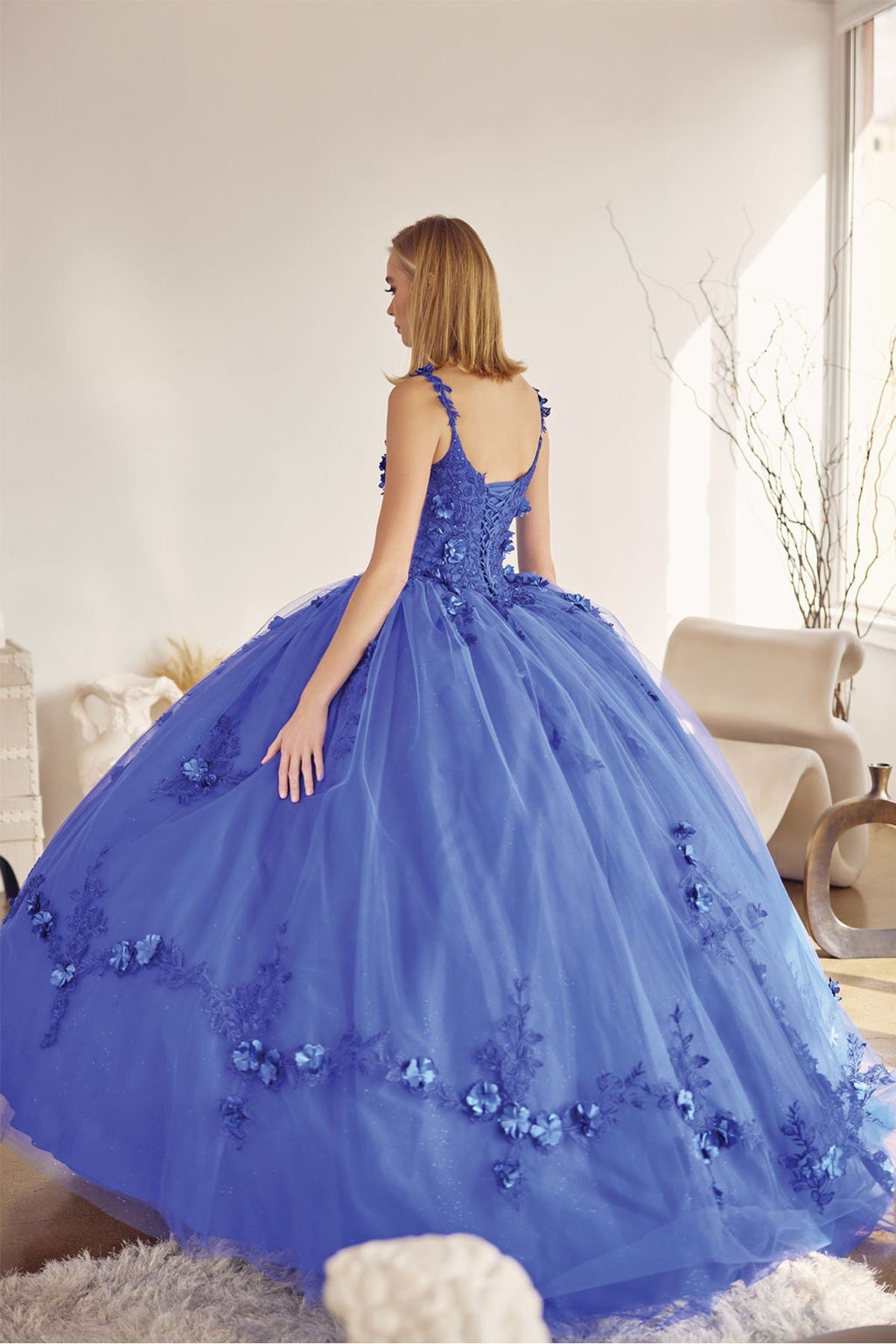 A-line ball quinceanera gown in royal blue with floral appliques, open back, full layered tulle skirt
