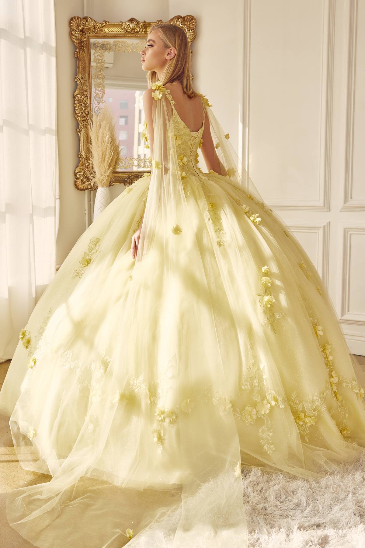 A-line ball quinceanera gown in pale yellow with gold appliques, strap bodice, full tulle skirt