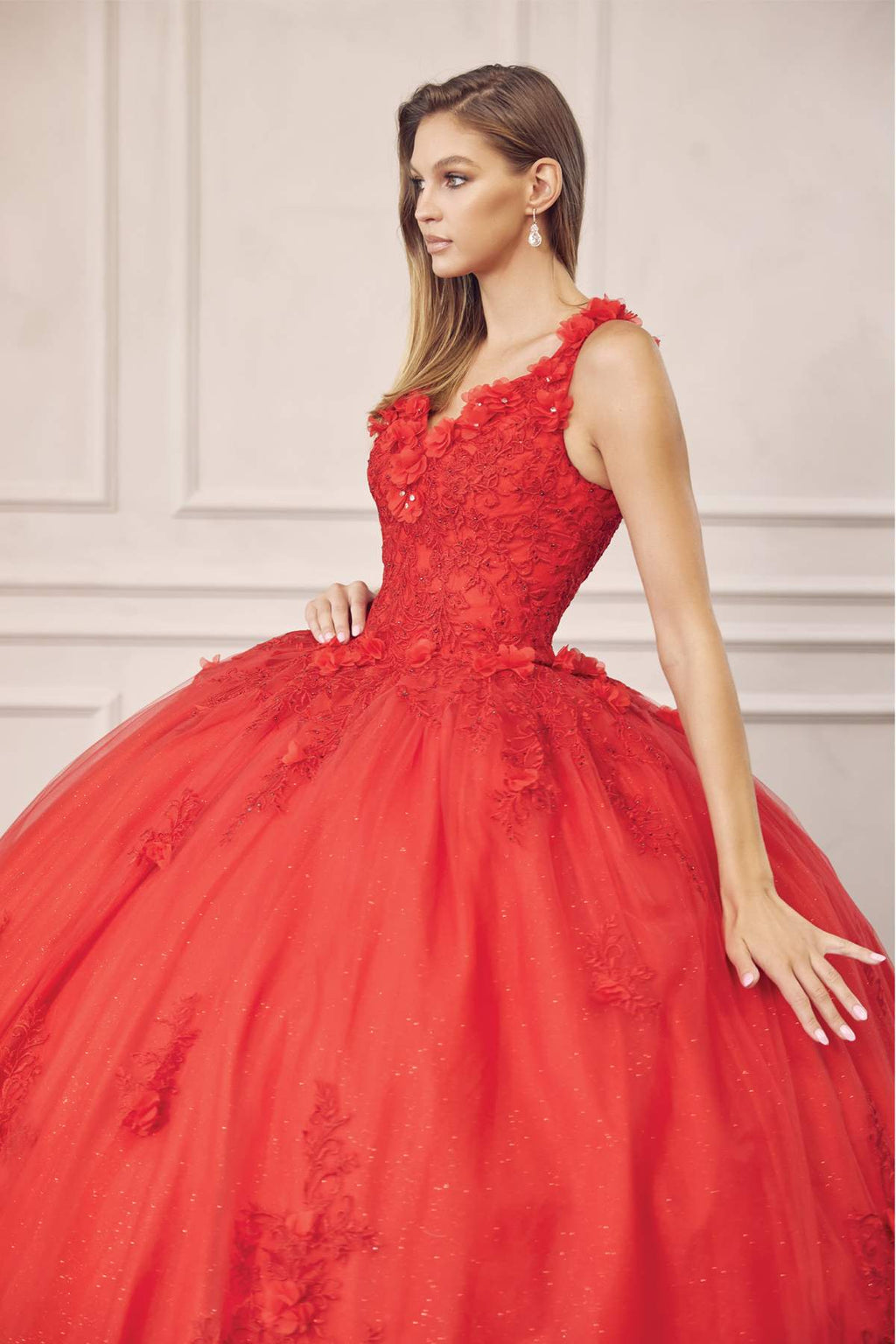 Red ball gown with V-neck lace bodice, sleeveless straps, floral applique skirt