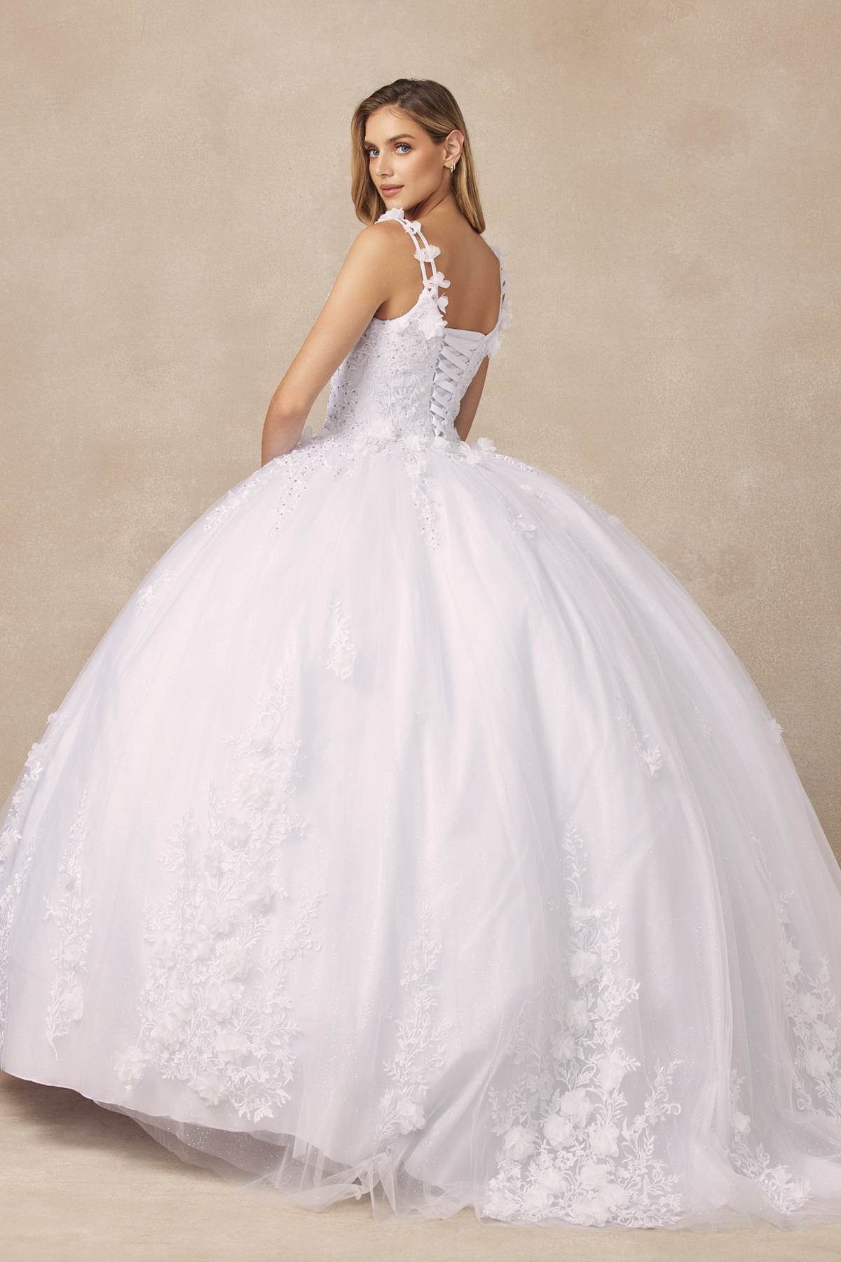 White quinceanera ball gown with floral appliques and 3D details, full A-line skirt
