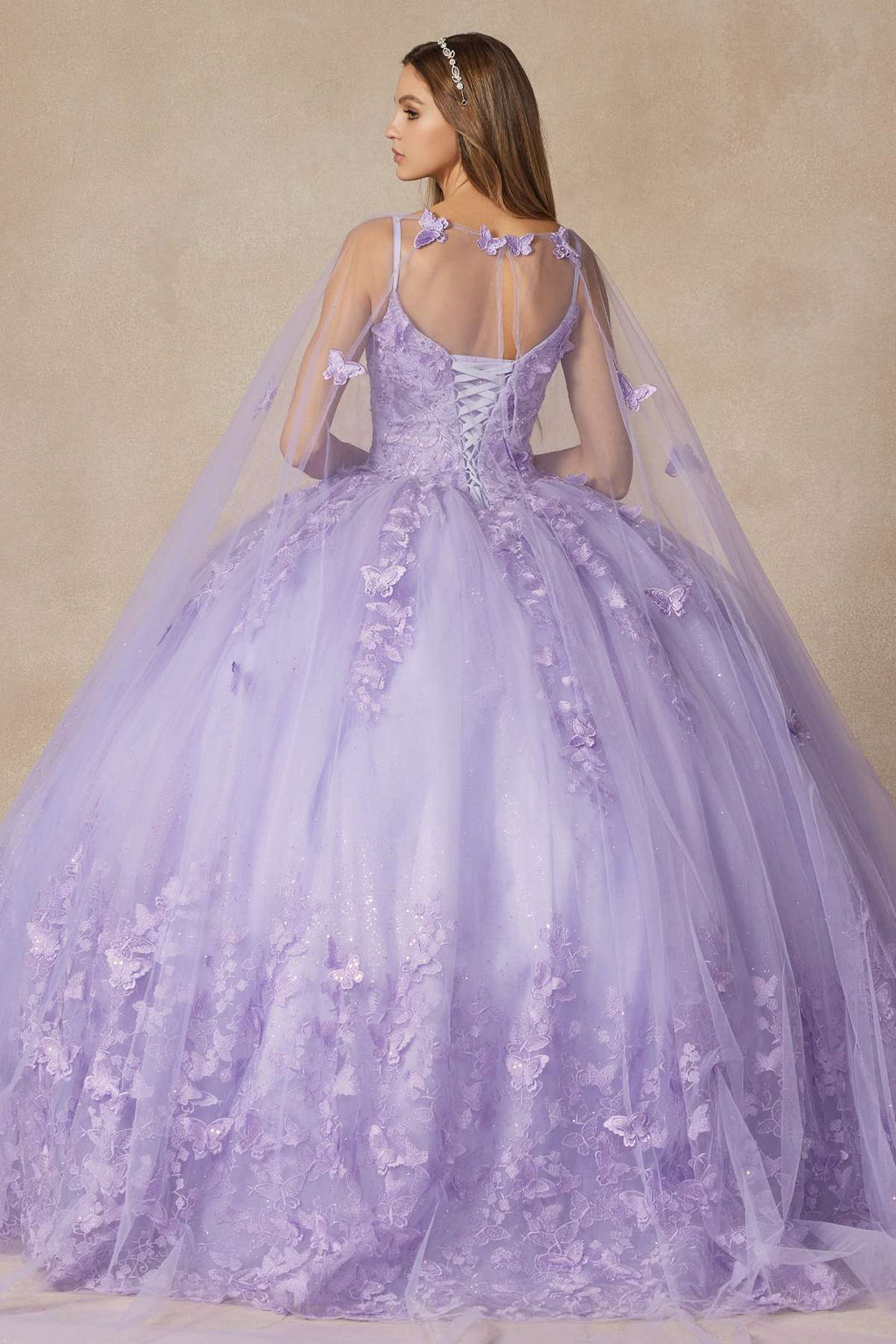 Lilac long quinceanera dress with butterfly appliques, corset bodice and flowing skirt
