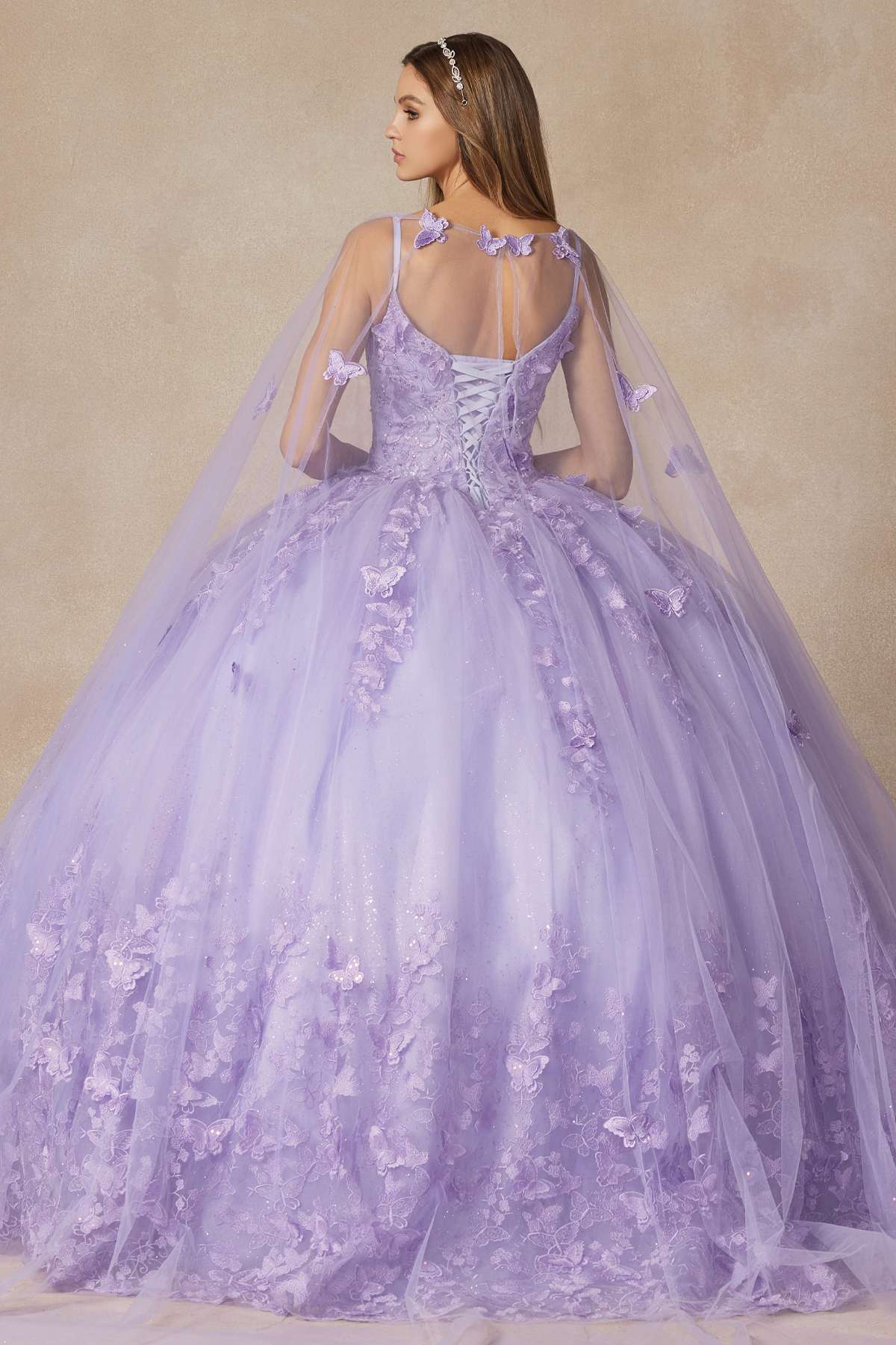 Lilac long quinceanera dress with butterfly appliques, corset bodice and flowing skirt