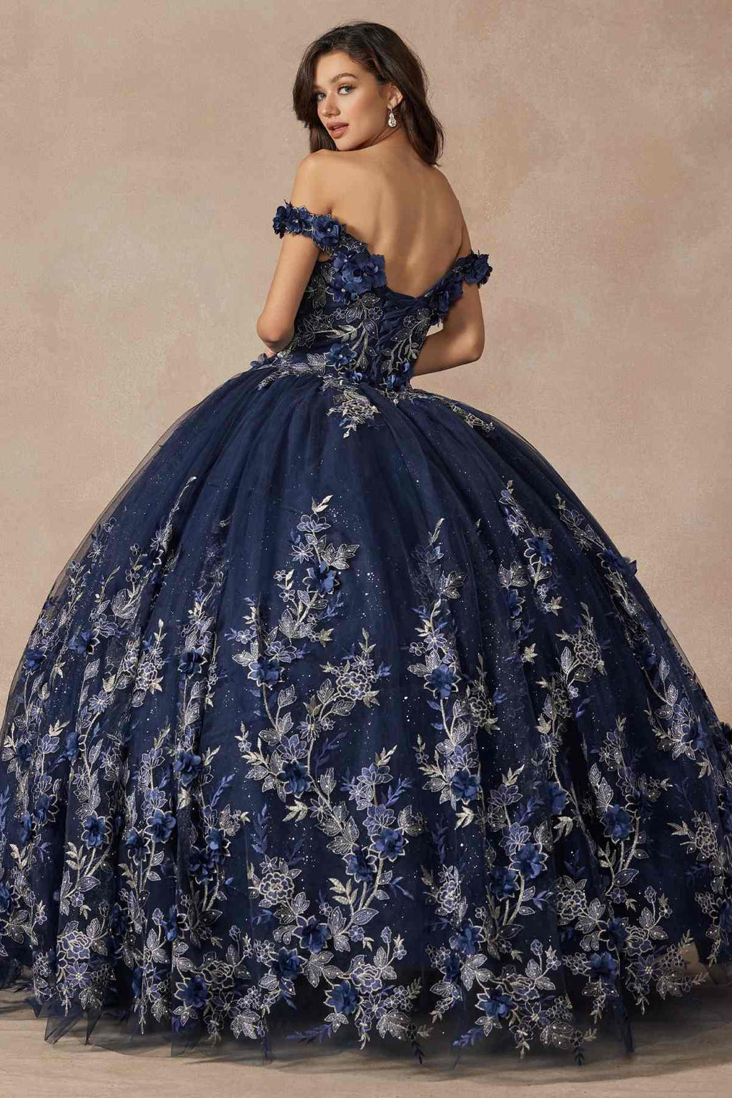 Blue off-shoulder ball gown with floral appliques across the skirt and ruffled neckline