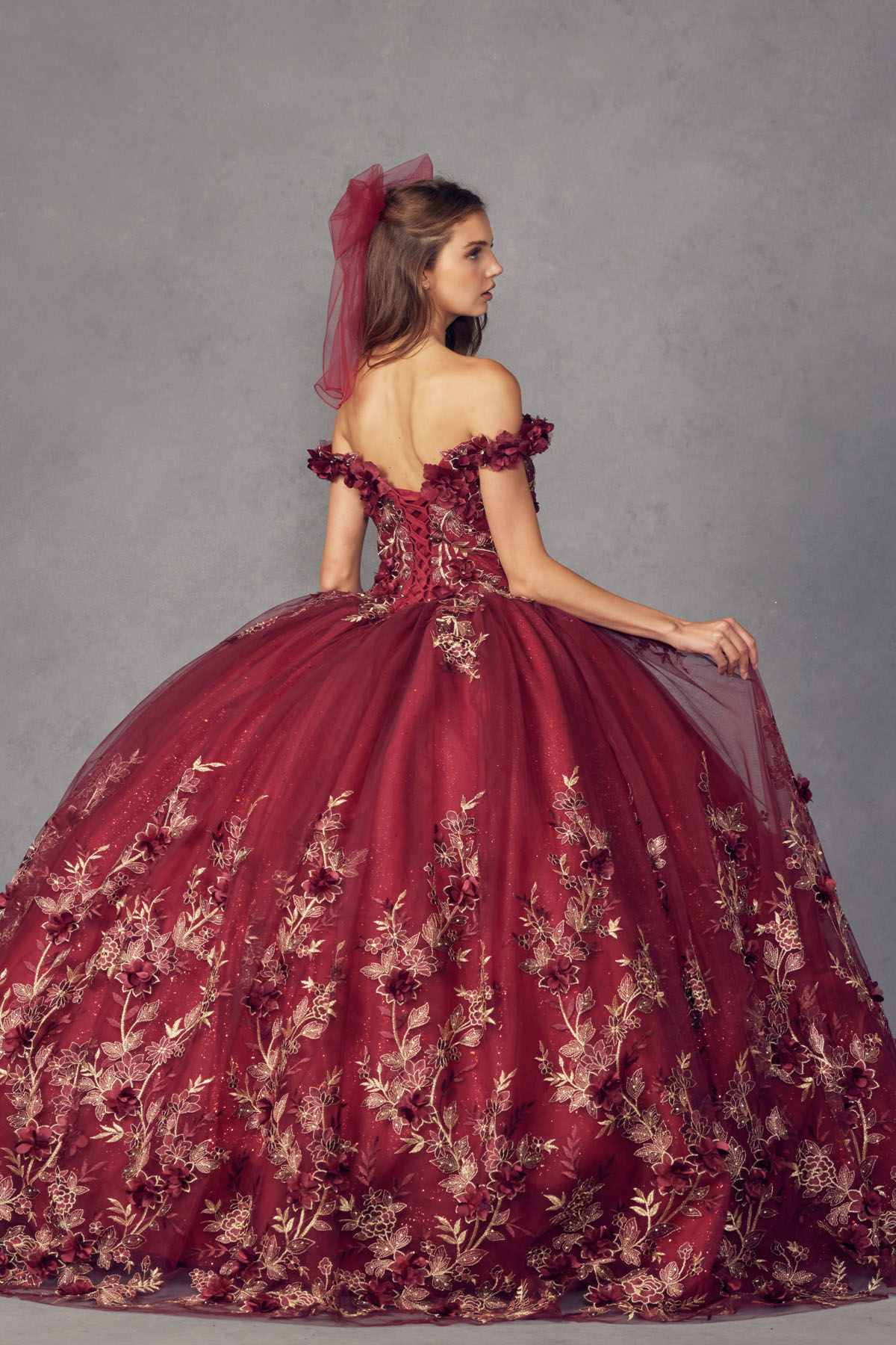 Burgundy off-shoulder ball gown with floral appliques and full skirt, side bow detail