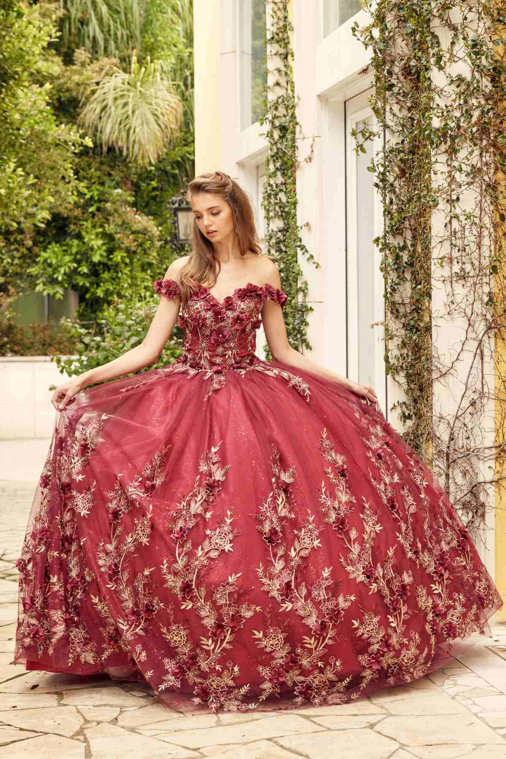Burgundy off-shoulder ball gown with embroidered floral appliques and voluminous skirt